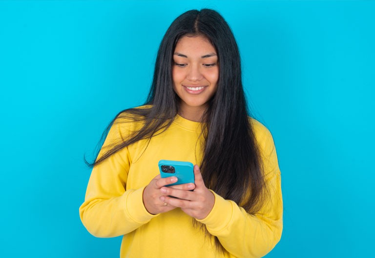 young latin woman holding phone