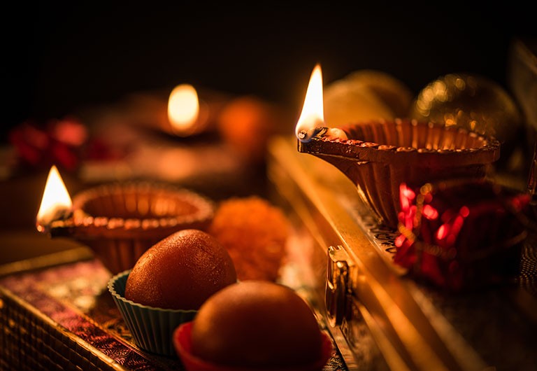 small oil lamps glowing in the dark