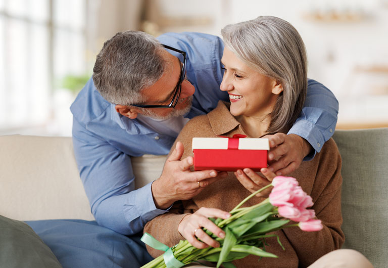 man giving a present to a woman